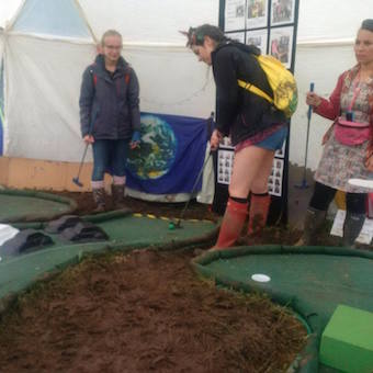 Golf in muddy conditions at Glastonbury festival